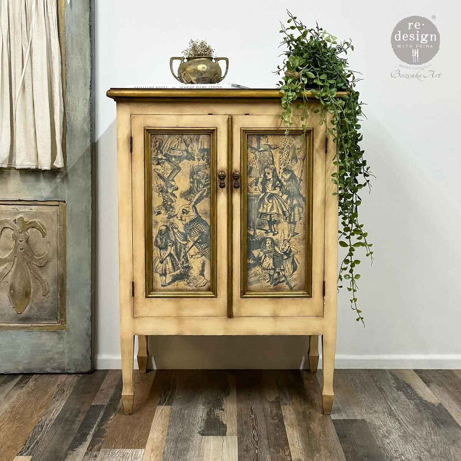 Distressed yellow cabinet with closed doors featuring Dreaming in Wonderland decoupage panels.