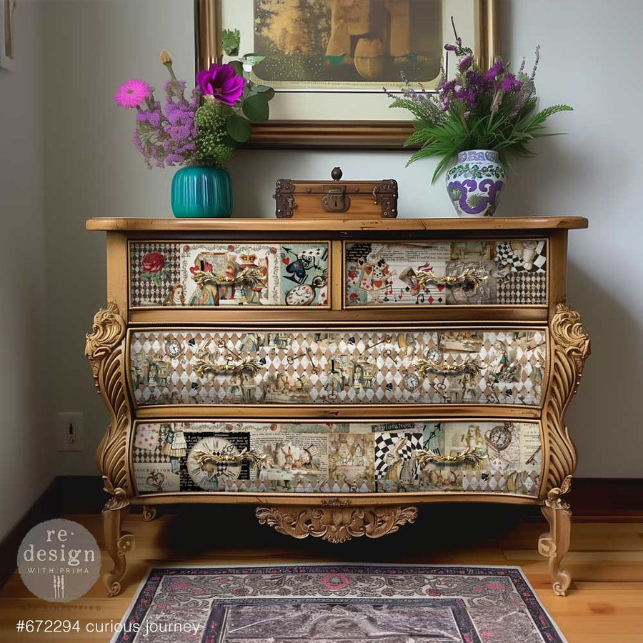 Elegant vintage gold dresser decorated with Redesign with Prima Curious Journey decoupage paper and ornate hardware.