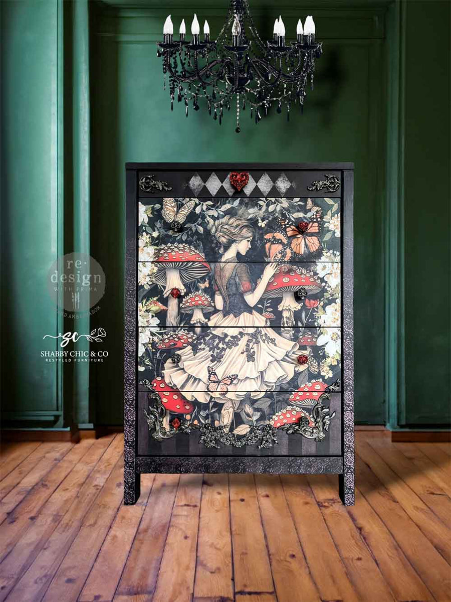 Furniture piece showcasing the Enigmatic Realm decoupage design on the front drawers, framed by black floral trim and topped with diamond patterns.