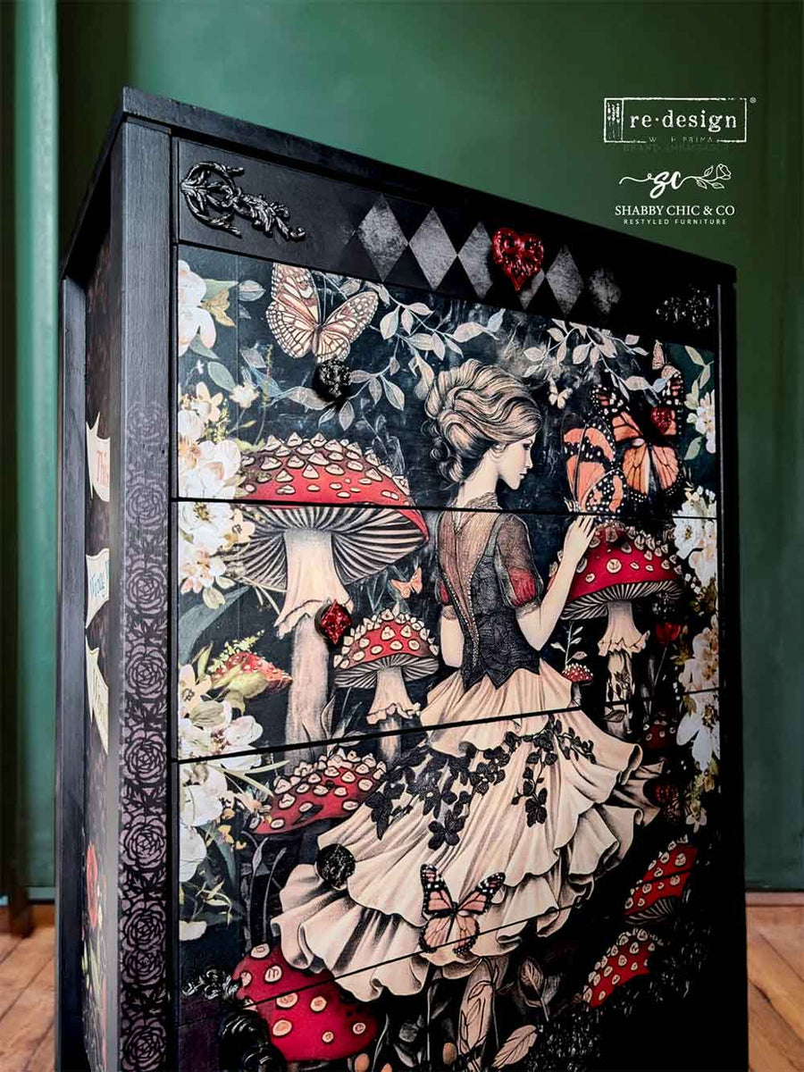Side angled view of a furniture makeover using Enigmatic Realm decoupage paper with ornate trim, floral accents, and bold mushroom imagery.