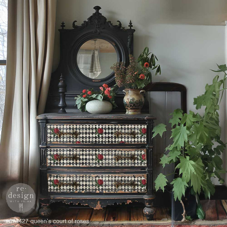 Vintage black dresser with mirror, featuring Queen’s Court of Roses tissue across the drawer fronts for a dramatic romantic look.