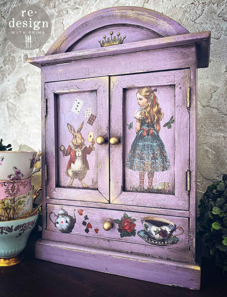 Purple cabinet decorated with Alice in Wonderland transfers – Alice, white rabbit, teacup, roses, and playing card symbols.