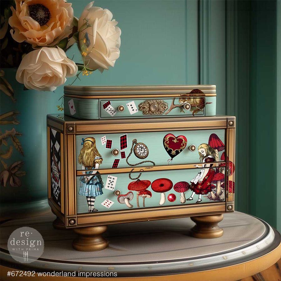 Styled vignette featuring Wonderful Impressions transfers applied to vintage furniture drawer front in pastel and gold accents